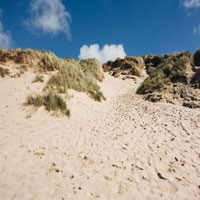 the hill of a beach dune that you cannot see over just yet