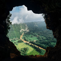 views through a mountain window, looking down upon a smoky valley